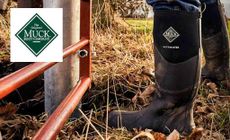 Muck Boots logo placed over an image of muck boots wellies on a farm 