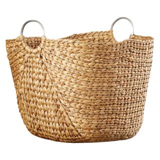 A wicker basket with silver handles