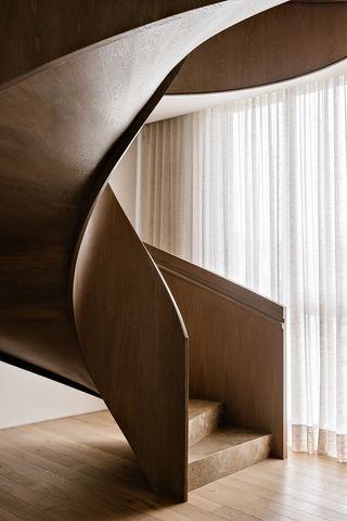 minimalist spiral staircase in an entryway