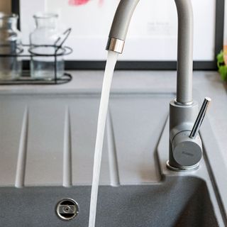 grey composite sink and tap