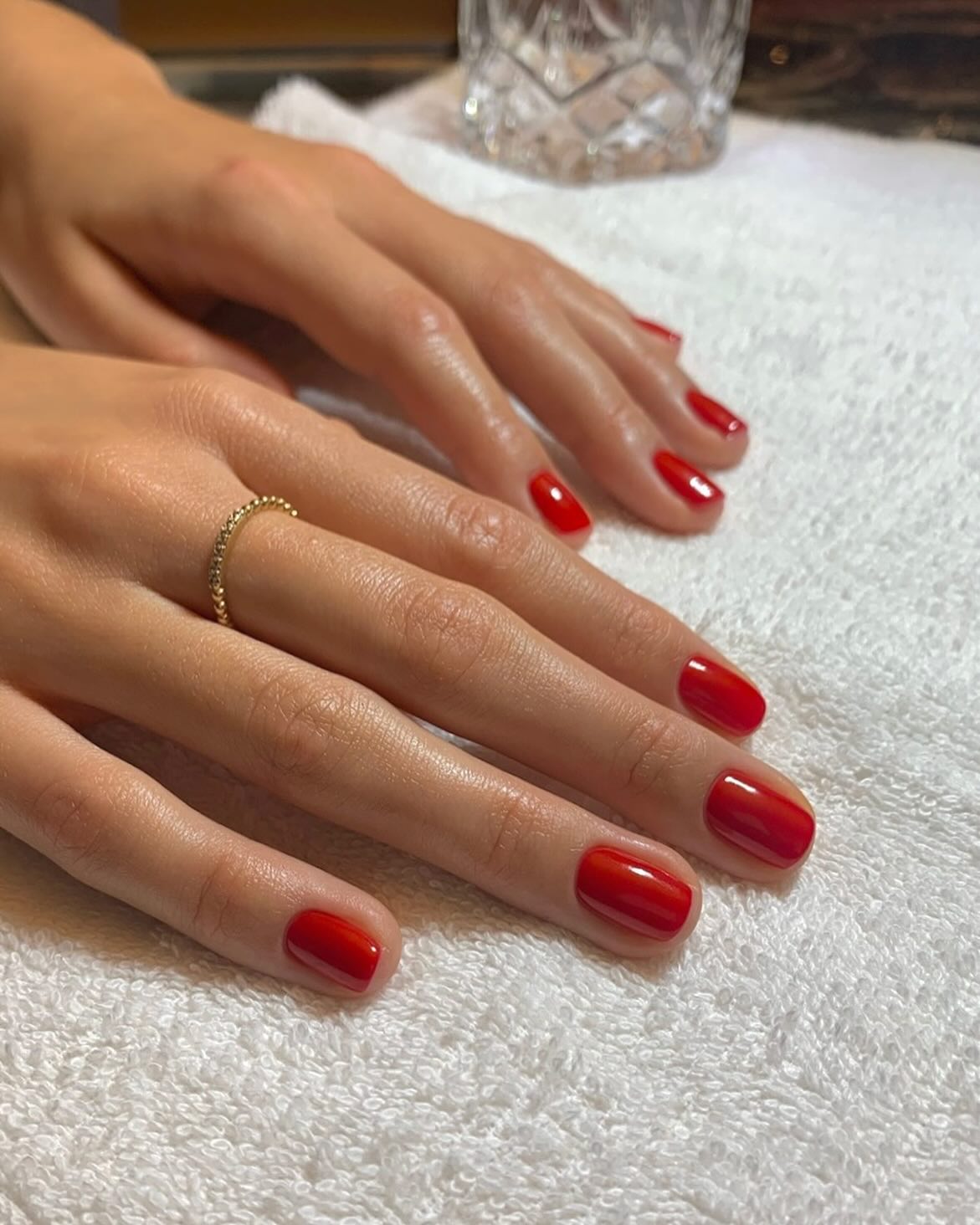 Tomato red manicure on short nails