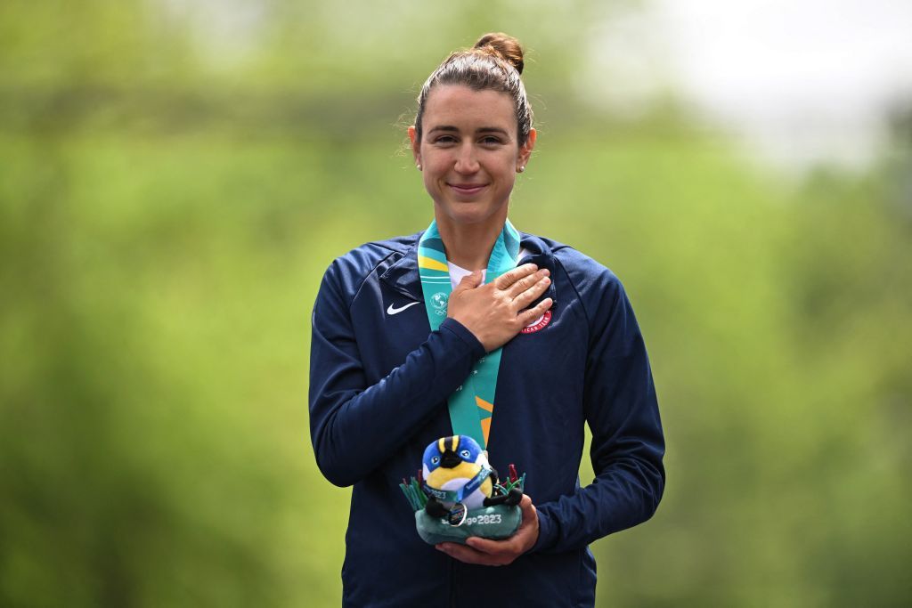 USA racer Kristen Faulkner stands on the podium with her gold medal after winning the womens individual time trial of the 2023 Pan American Games 