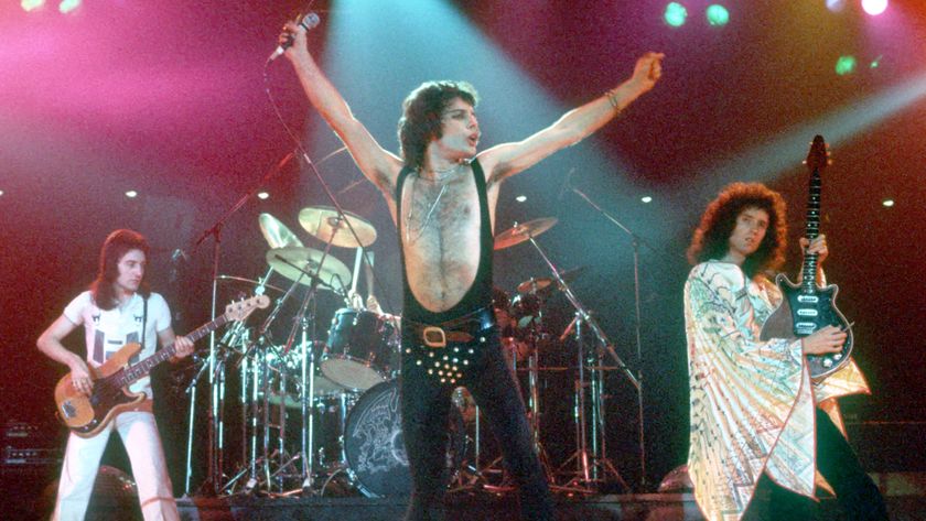 Queen perform in concert with Freddie Mercury wearing black leotard at the Forum on December 22, 1977 in Inglewood, California