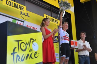 Toms Skujins on the stage 5 Tour de France podium for most aggressive rider