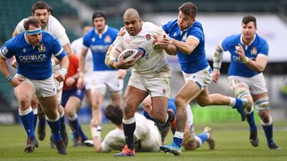 Kyle Sinckler of England is tackled by Luca Sperandio of Italy during the Guinness Six Nations match between England and Italy at Twickenham Stadium