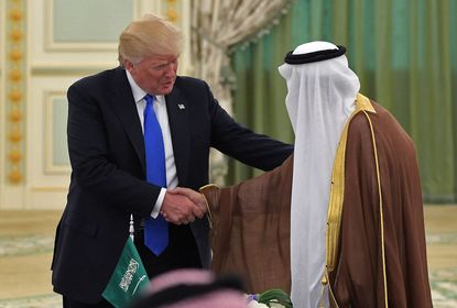 Trump shakes hands with Saudi Arabia's King Salman bin Abdulaziz al-Saud 