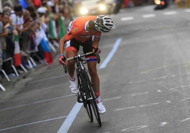 Nearing the finish line of the 2013 road race world championship, Marianne Vos (Netherlands) checks to see if any rivals are closing the gap
