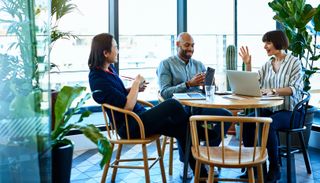 people in a cafe laughing