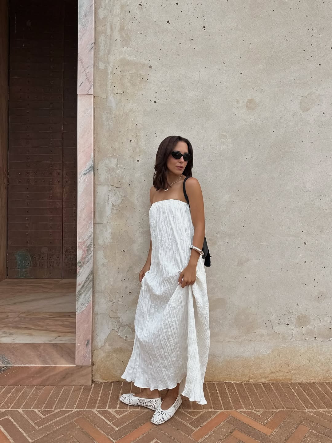 @deborabrosa wearing a white dress and crochet flats
