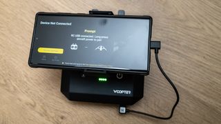 V-Copter Falcon Mini controller with phone attached