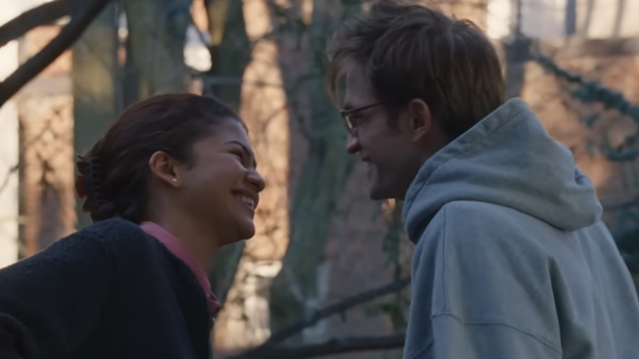 Zendaya and Robert Pattinson looking at each other and laughing