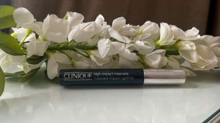 Clinique High Impact Mascara in front of flowers