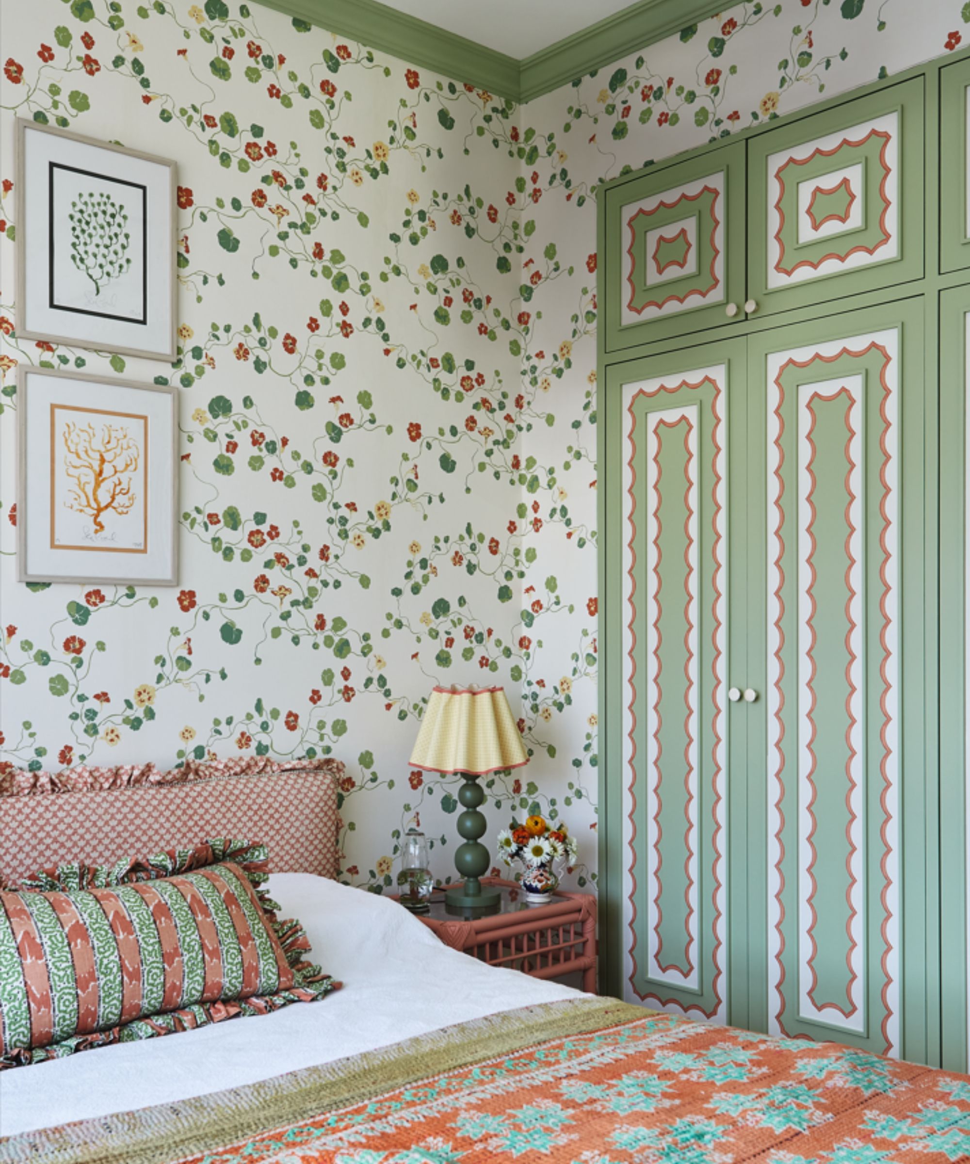 floral pink and green bedroom with geranium print floral wallpaper