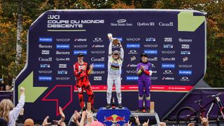 Valentina Höll on top of the podium in the 2023 Women's UCI Downhill World Cup