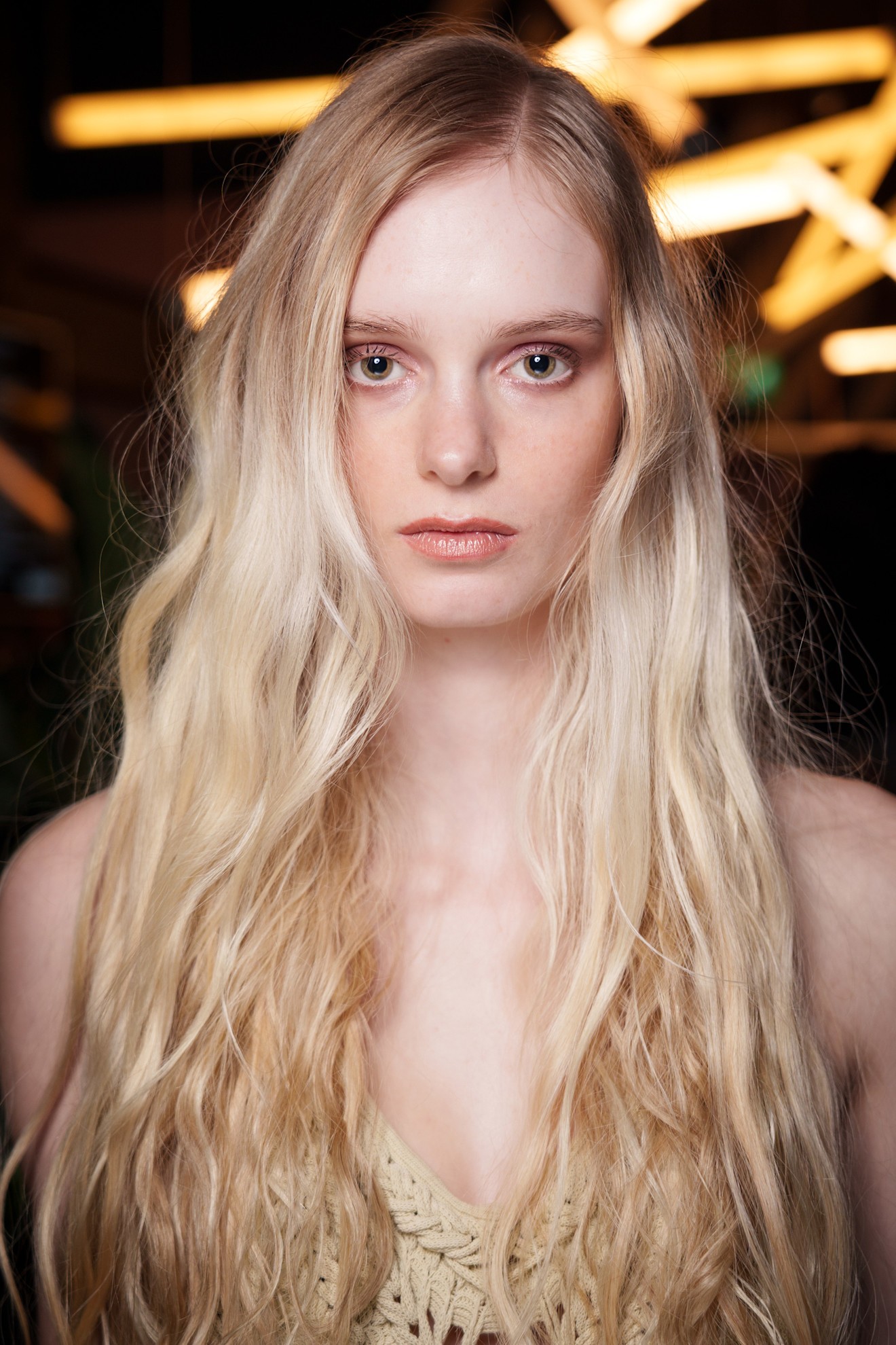 A model with long, shattered layers in her blonde hair
