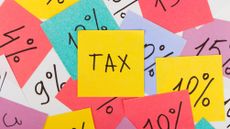 Brightly coloured post-it notes showing percentages and the word 'tax'