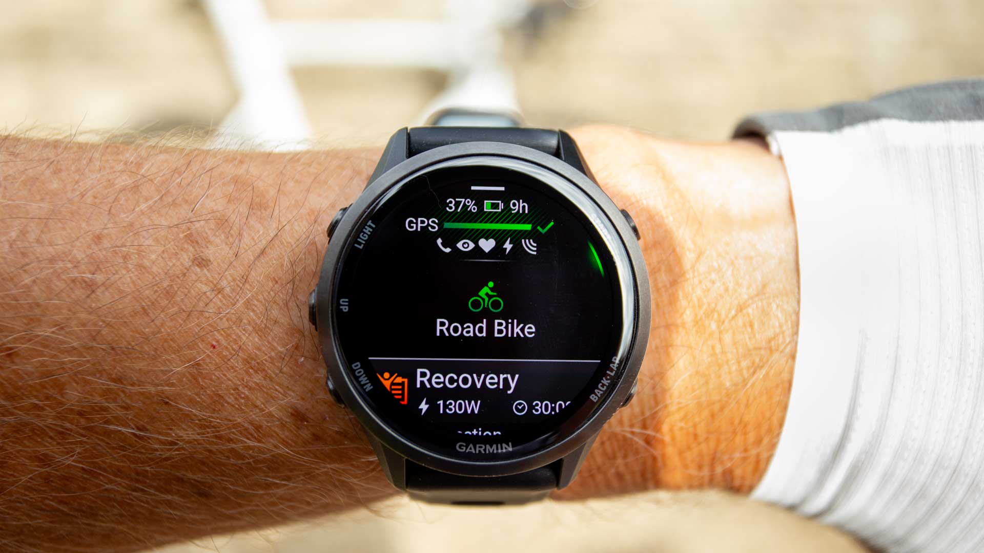 Garmin Forerunner 970 on wrist, with the Road Bike profile enabled