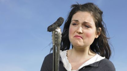 Woman looking sad after making a BBQ mistake