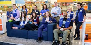 The cast of _Superstore_ featured on their iconic Cloud 9 couch.