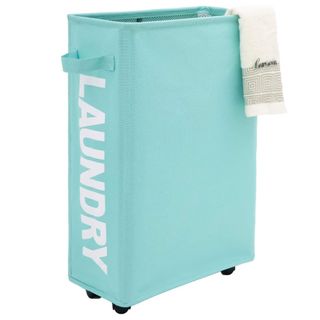 A light blue thin laundry basket has wheels and the word 