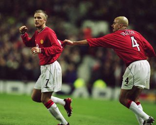 David Beckham celebrates with Juan Sebastian Veron after scoring for Manchester United against Nantes in 2002.