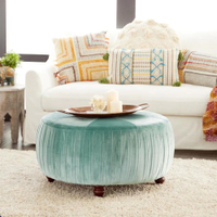 Grayson Lane&nbsp;Glam Blue Velvet Round Ottoman for $246, at Lowe's&nbsp;