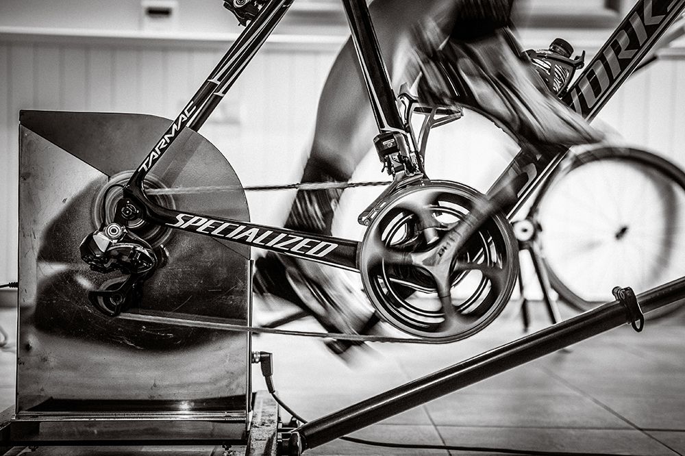 One of the riders does some work on the indoor trainer