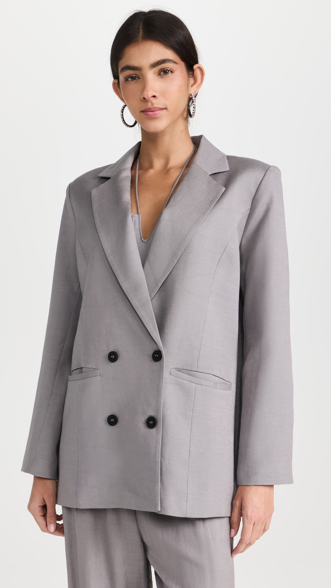 a model wearing a Gray double-breasted Blazer