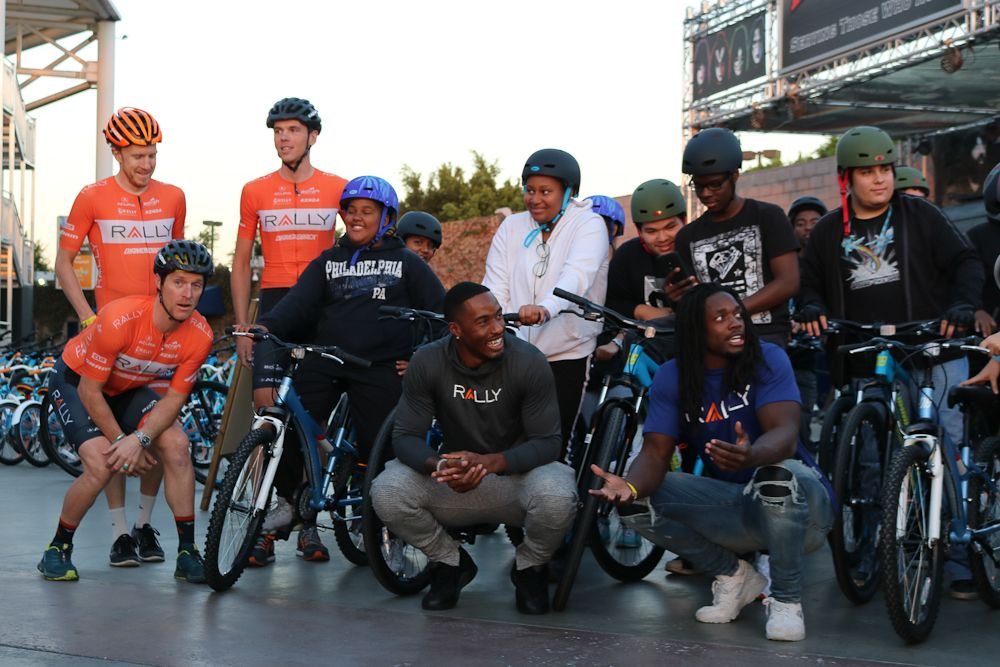Rally Cycling riders and Melvin Gordon with some of the kids at their recent bike build in LA