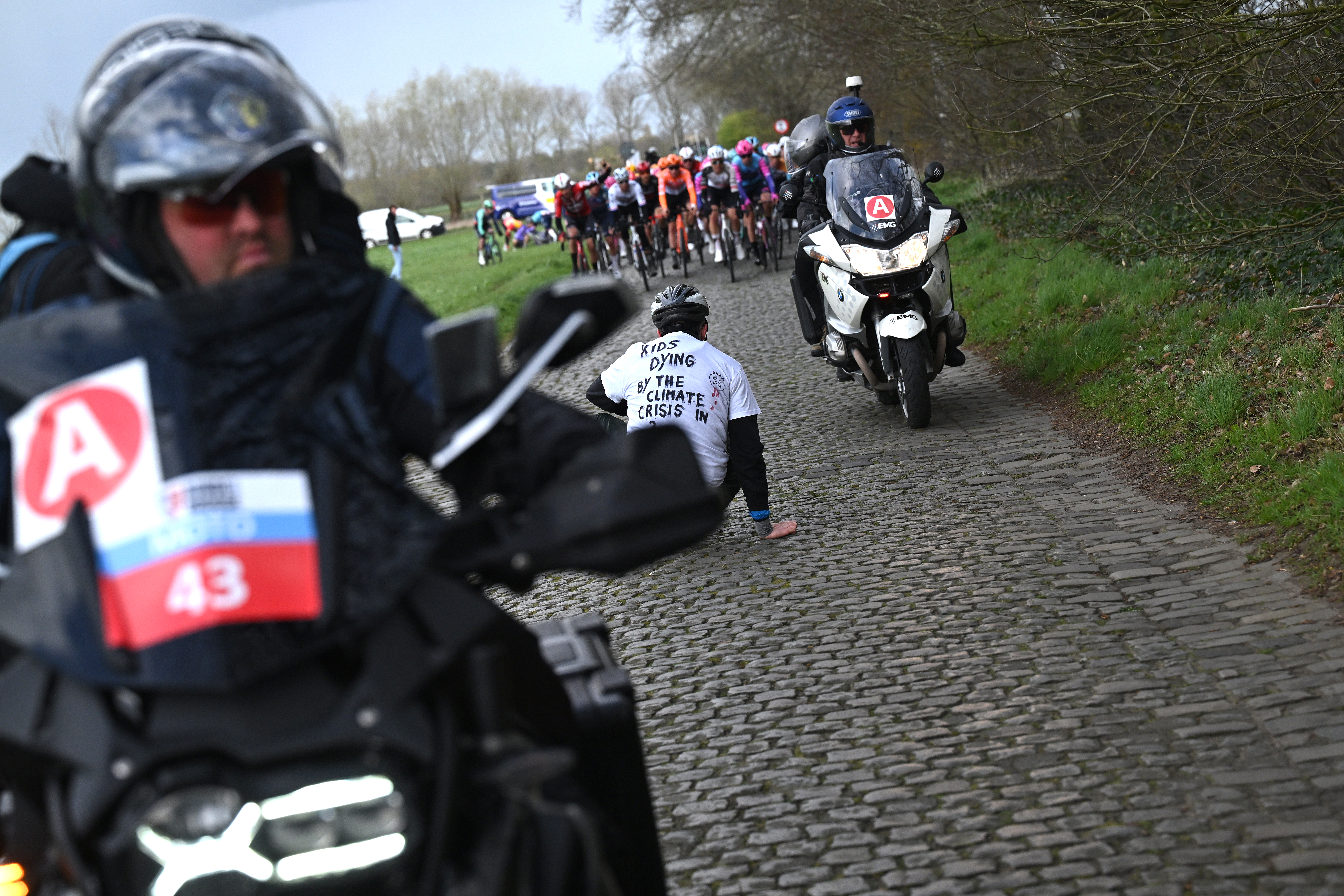 BRUGES, BELGIUM - MARCH 25: A protester tries to stop the race during the 50th Ronde Van Brugge - Tour of Bruges 2026 - Men&amp;apos;s Elite a 202.9km one day race from Bruges to Bruges / #UCIWT / on March 25, 2026 in Bruges, Belgium. (Photo by Luc Claessen/Getty Images)