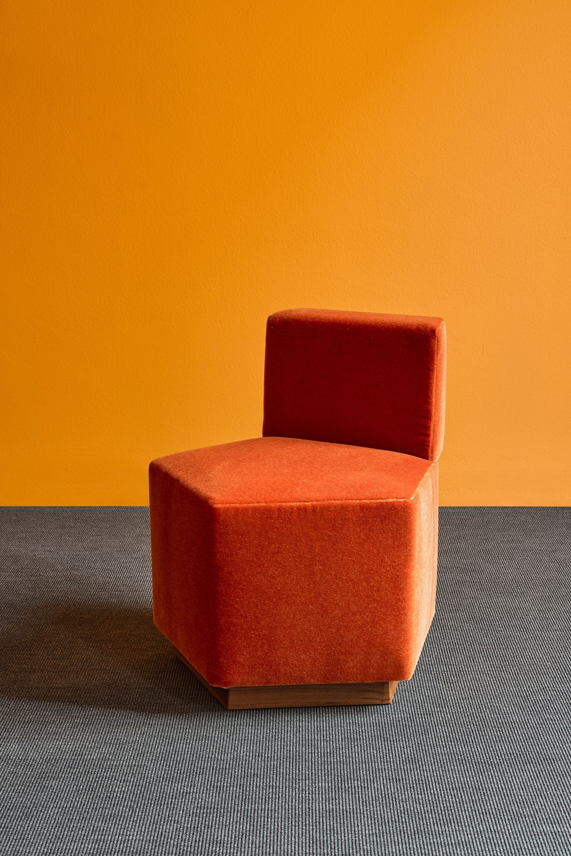 pentagon shaped chairs in bright colors on a bright background