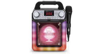 Karaoke machine with pink lights on the front and a microphone attached.