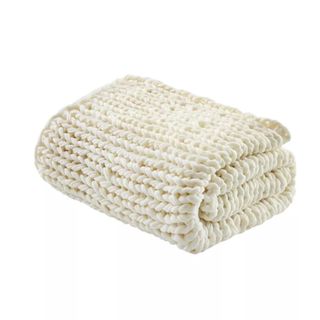 Cream colored chunky knit throw blanket