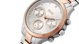 A close up of a BOSS rose gold ladies watch from Beaverbrooks on a white background.