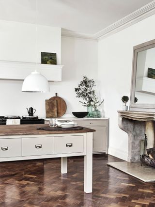 Traditional kitchen: cream kitchen with island and wooden floor