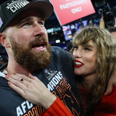 Travis Kelce and Taylor Swift celebrate the Kansas City Chiefs' win in the AFC Championship Game at MT Bank Stadium on January 28, 2024.