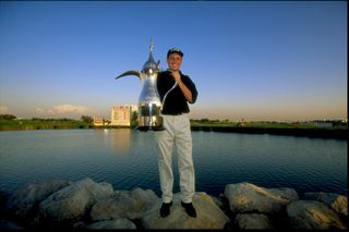 David Howell lifts the Dubai Desert Classic trophy after victory at the Dubai Creek Golf and Yacht Club in 1999