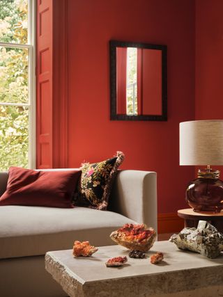 A bright, orange living room featuring an array of crystals