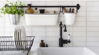 A sink with rail and containers for added storage