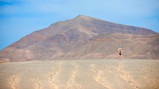 A man running across a desert