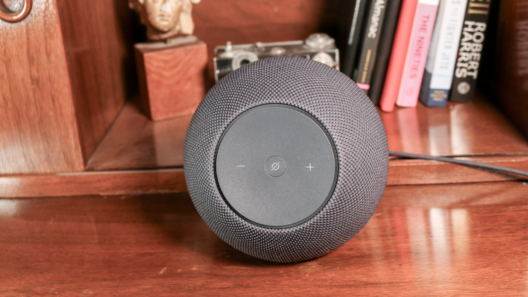 Amazon Echo Studio on a book shelf