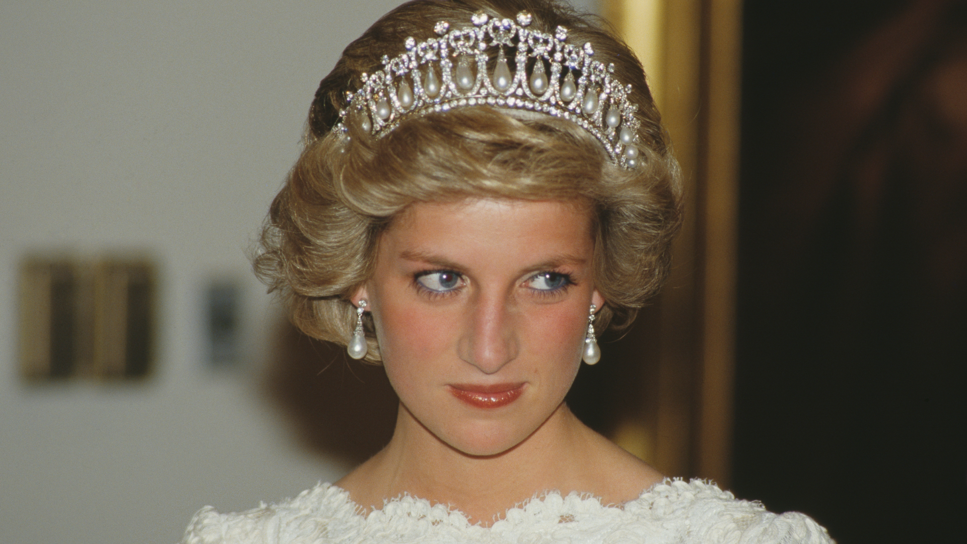Princess Diana wears a white lace bateau neck dress with the Spencer Tiara