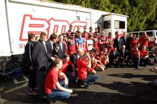 BMC Racing Team riders and staff get ready for a team photo.