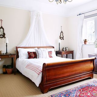 bedroom with sleigh bed with carpet floor