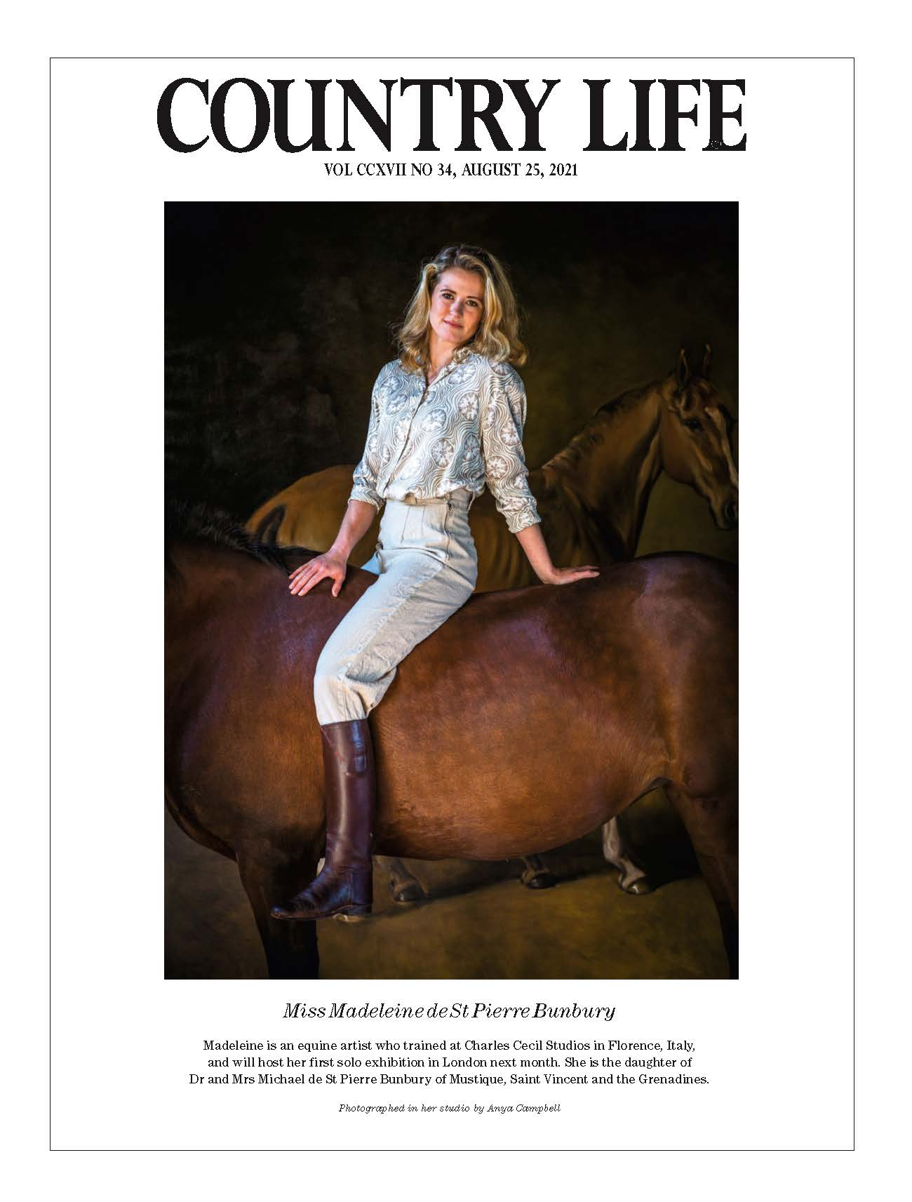 An image of a page from Country Life, showing the painter Madeleine Bunbury sitting on a horse
