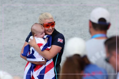 Amber Rutter hugs son Tommy after winning skeet shooting silver medal