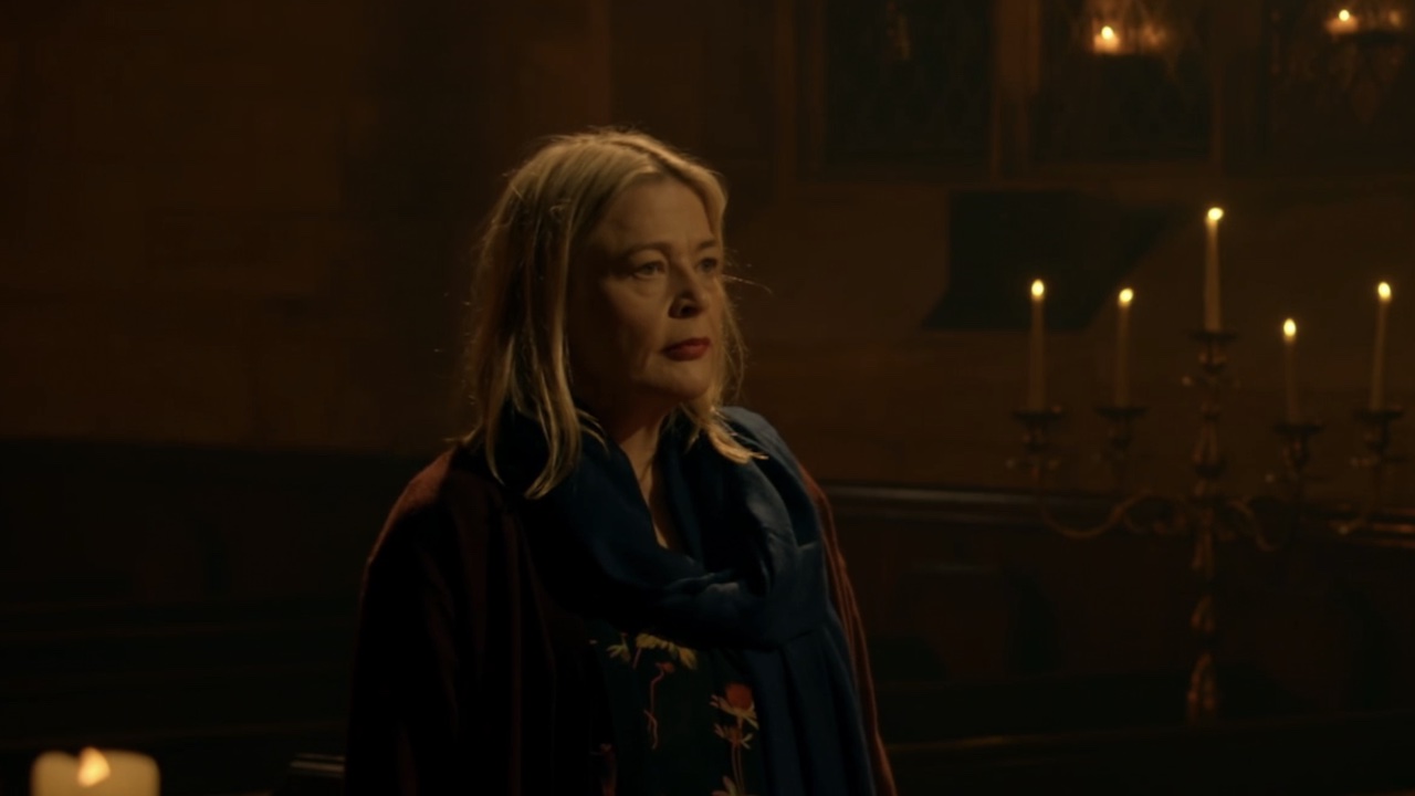 Harriet talking to the Traitors in the church.