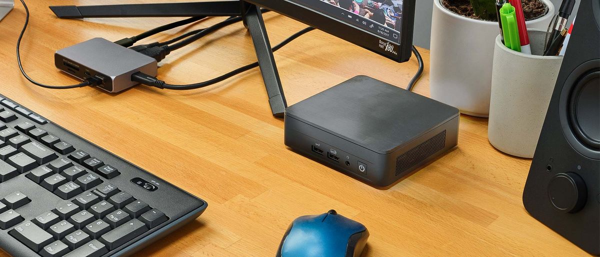 Intel NUC 12 Pro on desk next to monitor