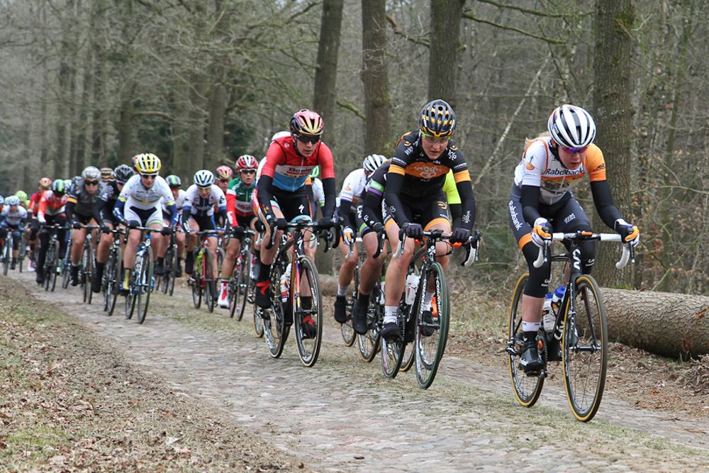 Anna van Der Breggen leading in the cobblestones.