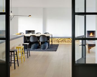 Penthouse using concrete, glass, steel and recycled timber as its primary materials.